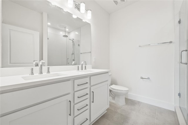 bathroom featuring toilet, tile patterned floors, walk in shower, and vanity