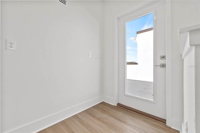 doorway with light hardwood / wood-style floors