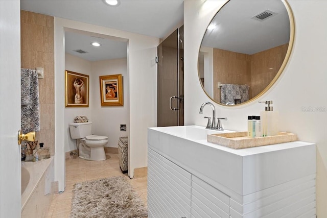 full bathroom with vanity, tile patterned flooring, plus walk in shower, and toilet