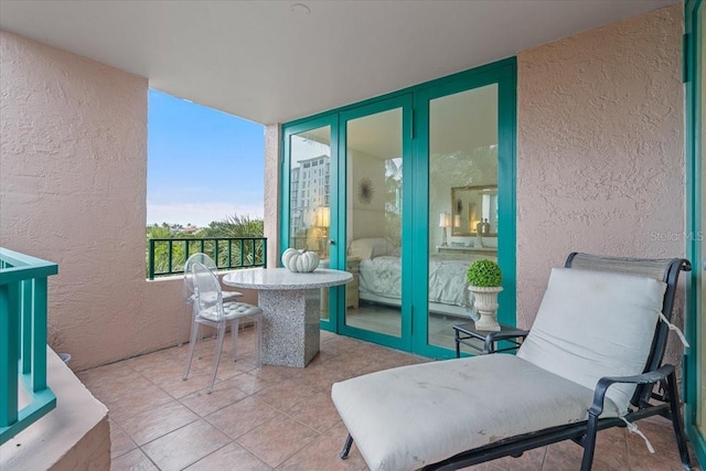 balcony featuring french doors