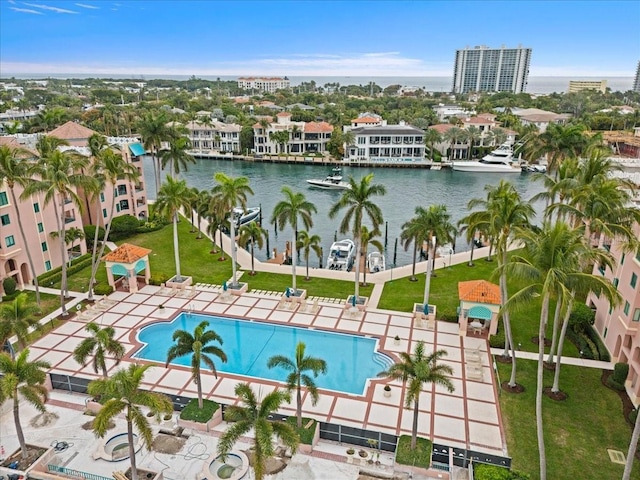 birds eye view of property with a water view