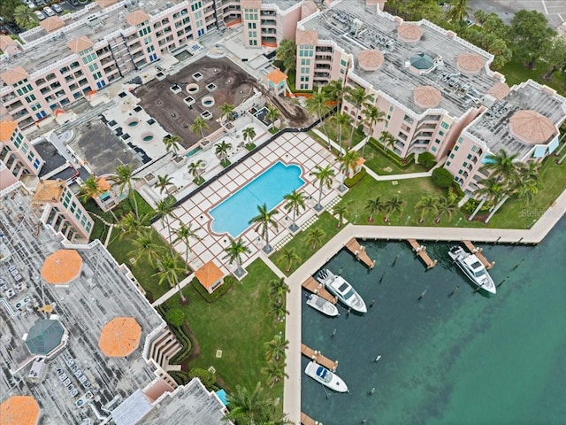 birds eye view of property with a water view