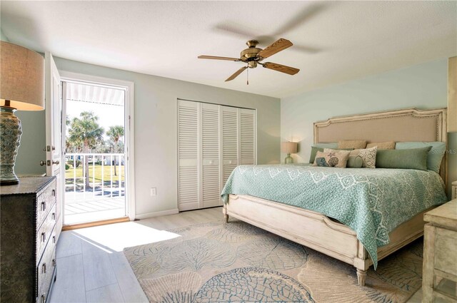 bedroom with access to exterior, a closet, ceiling fan, and light wood-type flooring