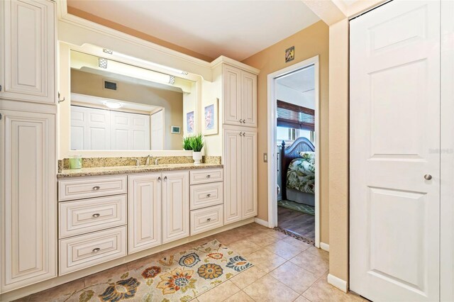 bathroom featuring vanity and tile patterned flooring