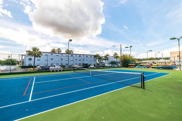 view of sport court featuring basketball hoop