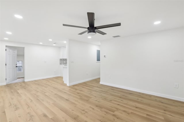 unfurnished room with ceiling fan and light hardwood / wood-style flooring