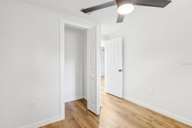 unfurnished bedroom featuring light hardwood / wood-style flooring and ceiling fan