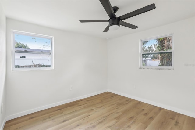 unfurnished room with light hardwood / wood-style flooring and ceiling fan