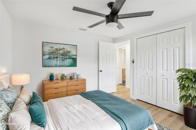 bedroom featuring a closet, ceiling fan, and light wood-type flooring