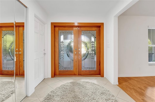 tiled foyer entrance with french doors