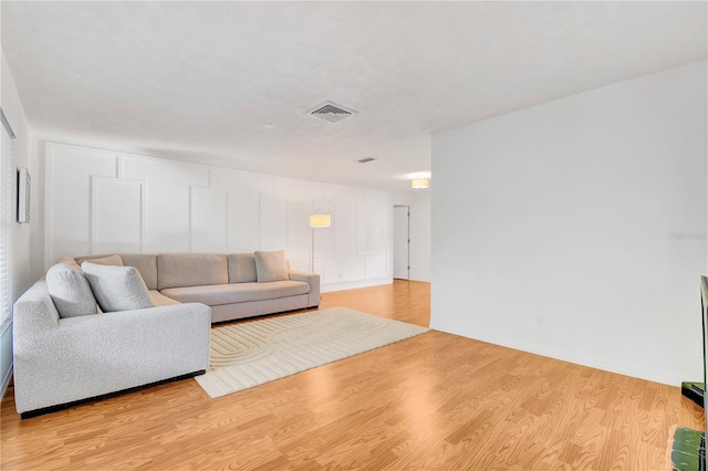 living room with light hardwood / wood-style flooring