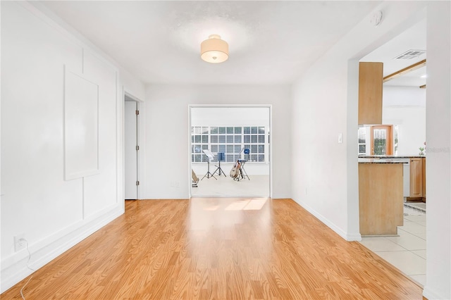 unfurnished room featuring light wood-type flooring