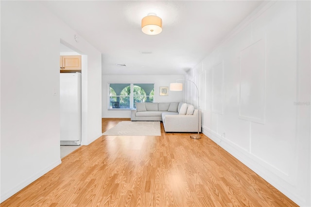 unfurnished living room with light wood-type flooring