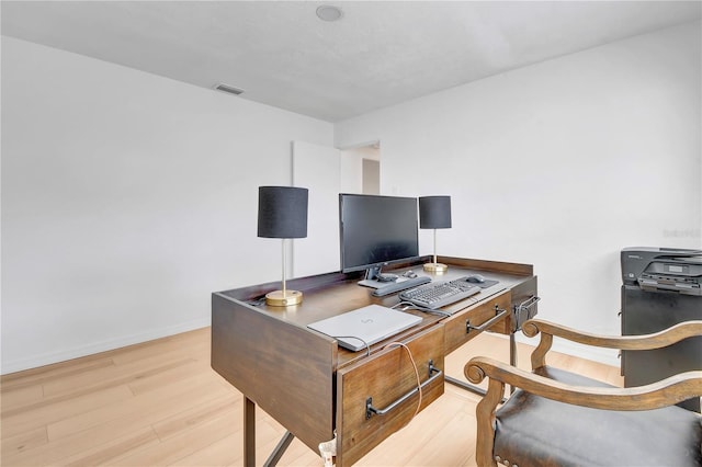 office space with light hardwood / wood-style floors