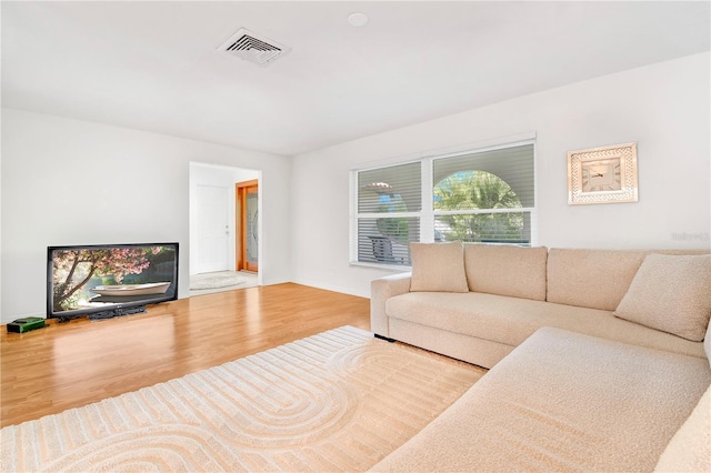 living room with light hardwood / wood-style floors