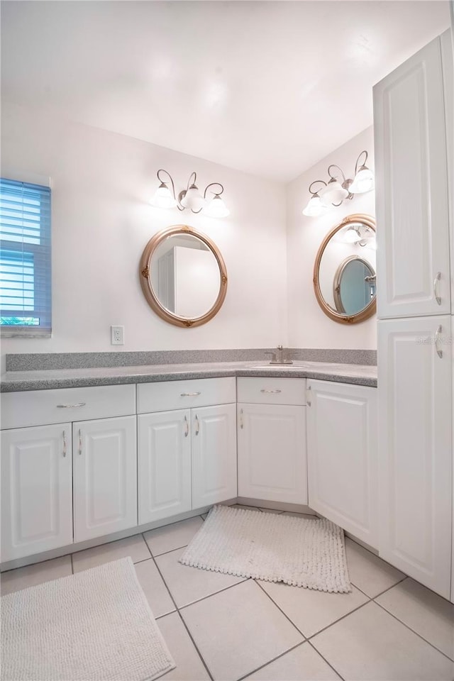 bathroom with tile patterned floors and vanity