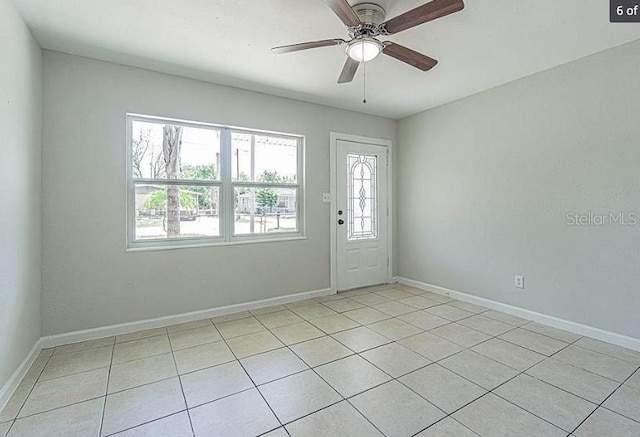 interior space featuring ceiling fan and light tile patterned floors