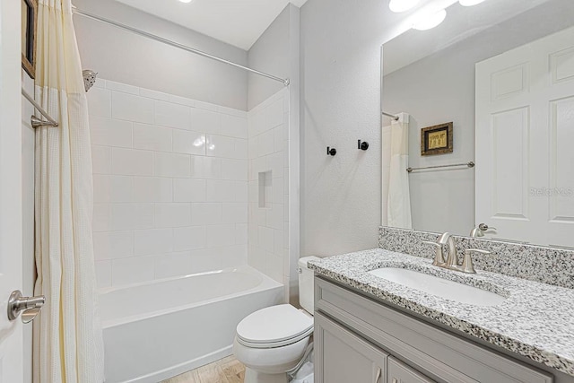 full bathroom with toilet, shower / bathtub combination with curtain, and vanity