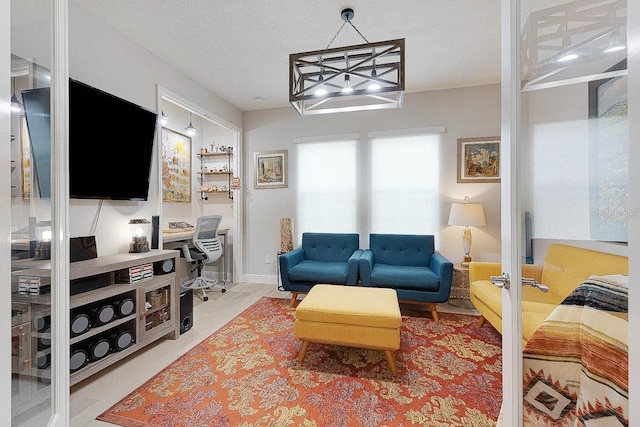 living room featuring a textured ceiling