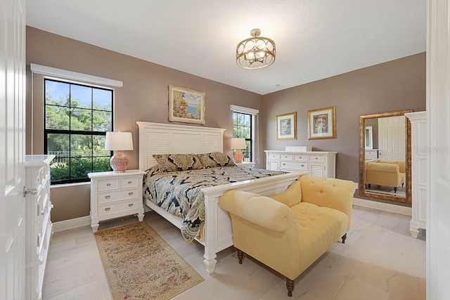 bedroom with a chandelier