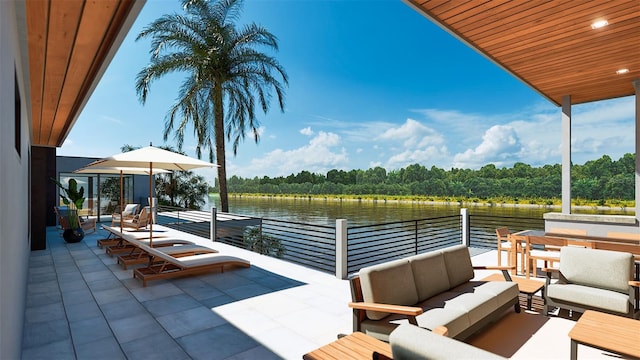 view of patio / terrace with an outdoor living space, a balcony, and a water view