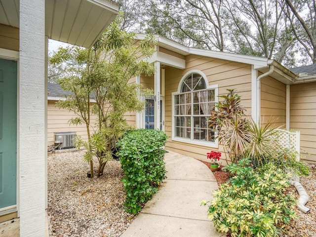 doorway to property featuring cooling unit