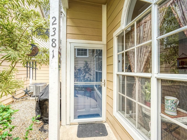 doorway to property with central AC unit