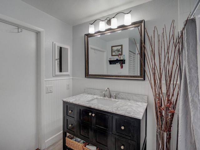 bathroom featuring hardwood / wood-style flooring and vanity