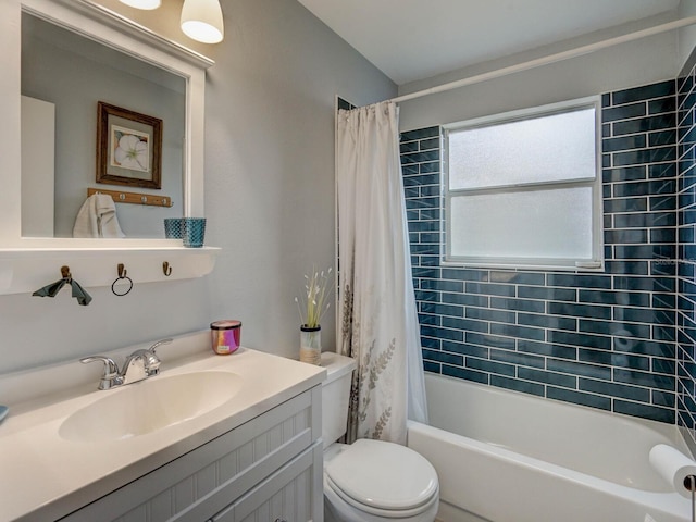 full bathroom with toilet, shower / tub combo, and vanity