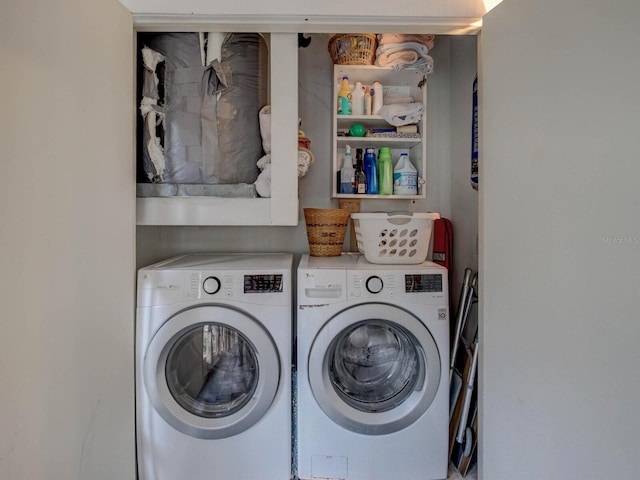 laundry area with washing machine and dryer