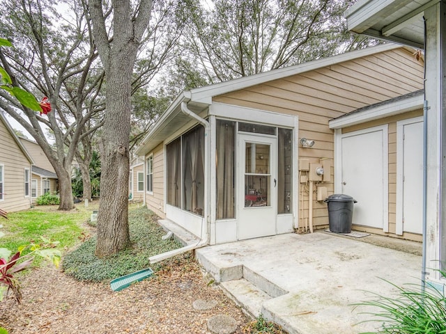 property entrance featuring a patio