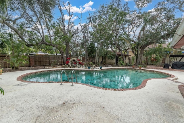 view of swimming pool with a patio area