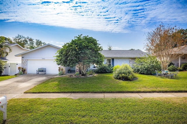 ranch-style home with a front lawn and a garage