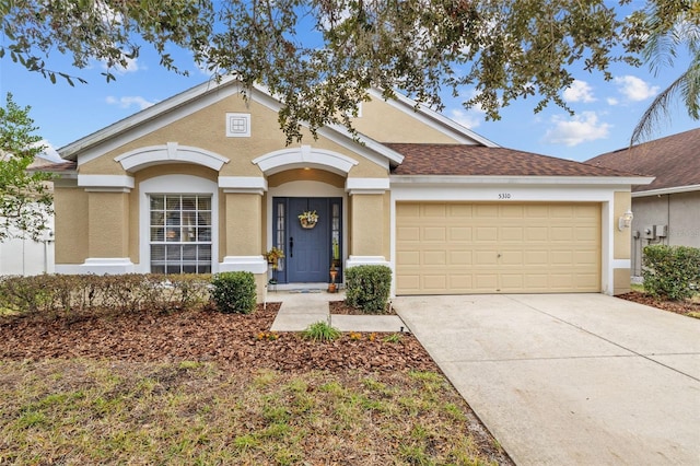 ranch-style house featuring a garage