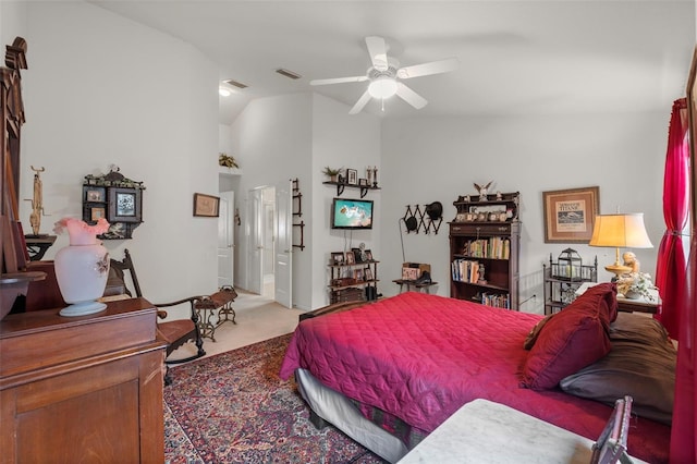 bedroom with vaulted ceiling, carpet, and visible vents