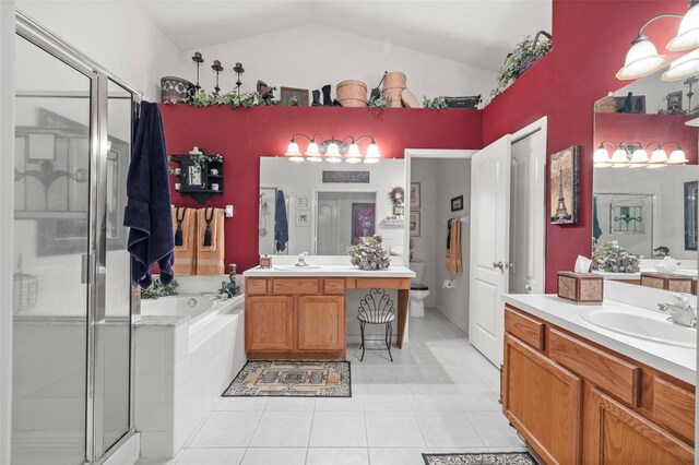 full bathroom featuring a stall shower, vaulted ceiling, and a sink