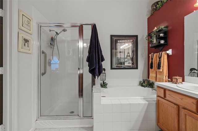 full bath featuring a stall shower, vanity, and a bath