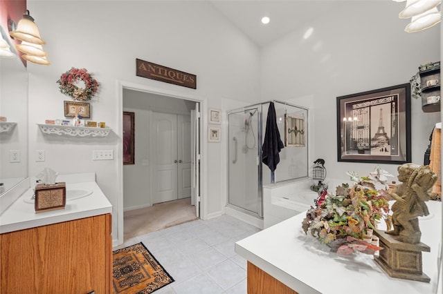 full bathroom with a stall shower, vanity, high vaulted ceiling, tile patterned flooring, and a bath