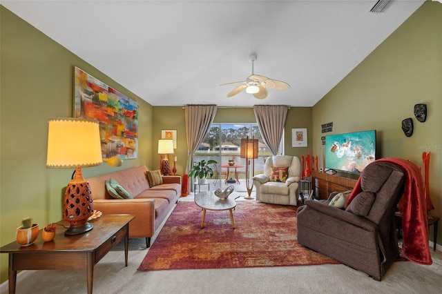 living area with lofted ceiling, carpet flooring, ceiling fan, and visible vents