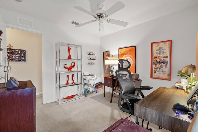 home office featuring baseboards, ceiling fan, visible vents, and carpet flooring