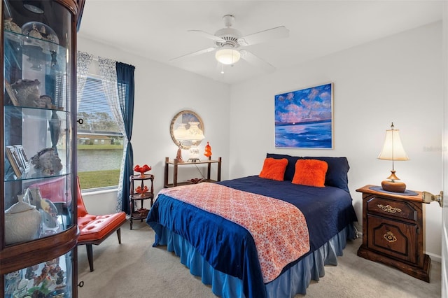 bedroom featuring ceiling fan and light colored carpet