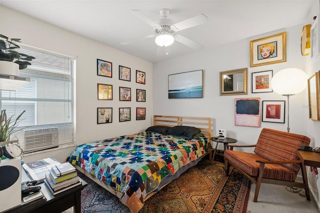 bedroom featuring ceiling fan, carpet, and cooling unit