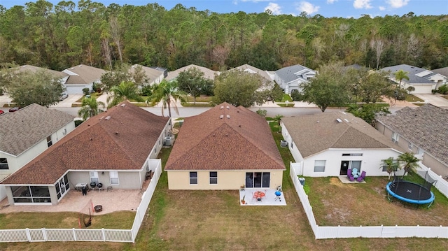 bird's eye view featuring a wooded view