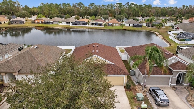 drone / aerial view with a water view and a residential view