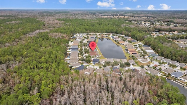 aerial view featuring a water view, a residential view, and a view of trees