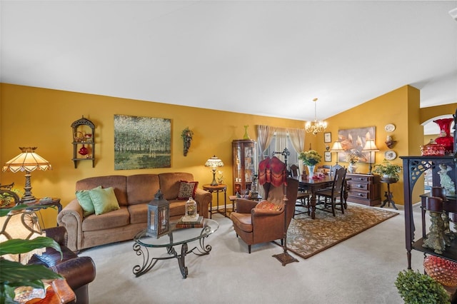 carpeted living area with a notable chandelier and vaulted ceiling