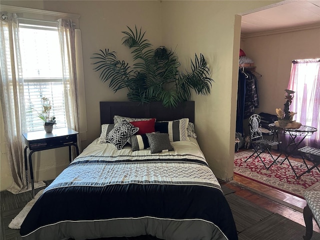 bedroom with crown molding