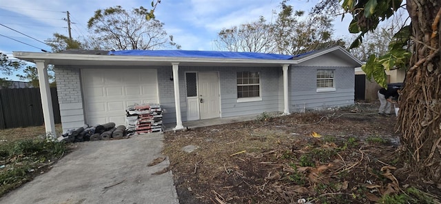 ranch-style house featuring a garage