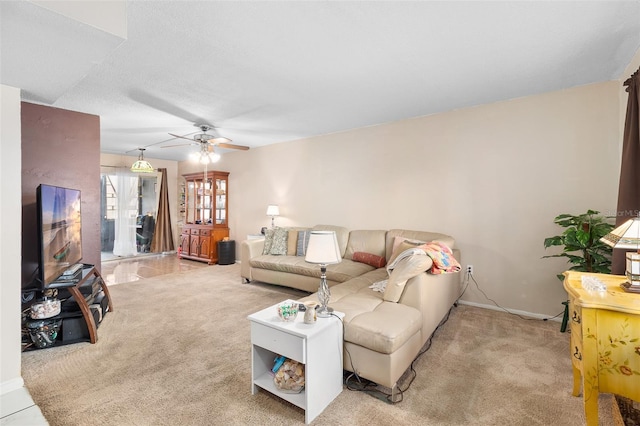 living room featuring light carpet and ceiling fan