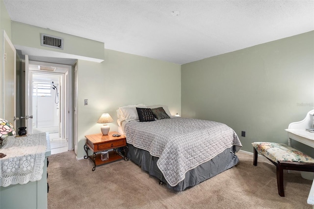 carpeted bedroom with a textured ceiling